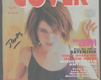 May include: Cover of a magazine called "Cover" featuring a woman with short brown hair. The magazine cover has the text "Valentina Cervi" and "Puts the art in Artemisia". The magazine cover also has the text "Chris Stills Acetone Full on the Mouth The Coos" and "Plus Timothy Greenfield-Sanders on Lou Reed".
