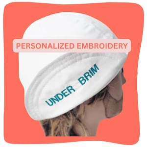 May include: A white cap featuring the text PERSONALIZED EMBROIDERY in a rectangular box above the crown and the words UNDER BRIM embroidered in teal thread along the underside of the brim, showcasing a custom design detail on the headwear.