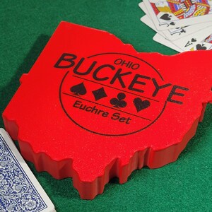 Ohio Buckeye, Euchre Playing Card Box - Includes deck of cards, 2 trump markers in Ohio shaped plastic box - Bonus Ohio Trivia deck included