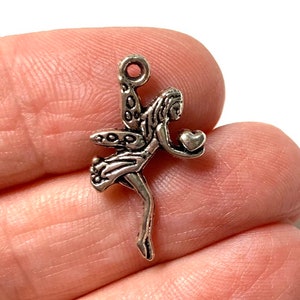 5-20 Silver tone Fairy with heart charms. Pixie charm with heart, garden fairy pendant. Fantasy charm.