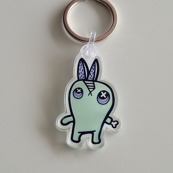 Acrylic keychain with turquoise zombie rabbit illustration