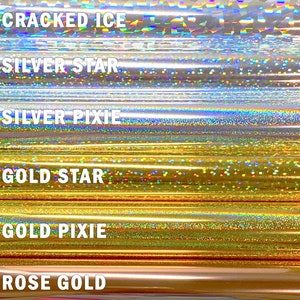 May include: Six different holographic vinyl rolls with the names "Cracked Ice", "Silver Star", "Silver Pixie", "Gold Star", "Gold Pixie", and "Rose Gold" printed on them.