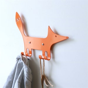 A metal hook in the shape of fox in a orange color. Kids wall hook. Gift for kids. Organizer for kids clothes.