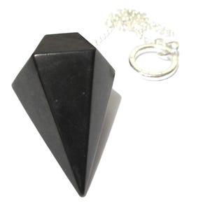 May include: A black, faceted crystal pendulum with a silver-colored chain and ring. The pendulum is a dark, opaque color and has a pointed bottom. The chain and ring are bright and shiny.