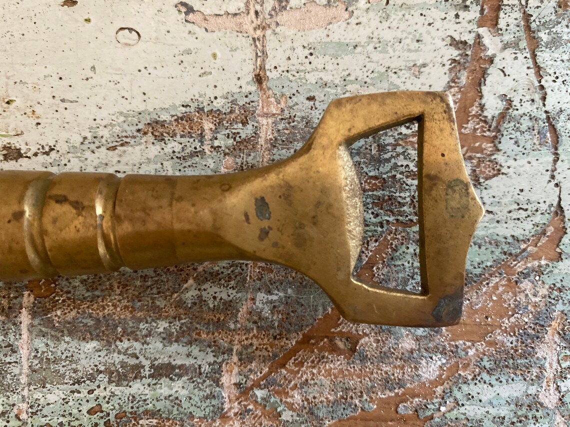 Vintage brass bottle opener / liquor store souvenir | Etsy