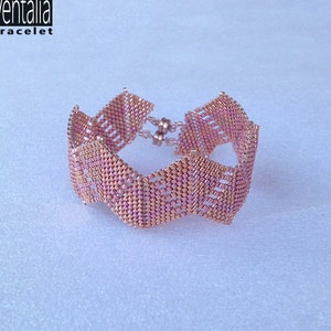 May include: A pink and gold beaded bracelet with a wavy design. The bracelet is called "Ventalia bracelet".