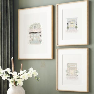 A set of three watercolor art prints featuring a boulangerie, a florist, and a patisserie, perfect for Parisian-inspired home decor.