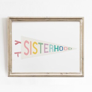 Feminist pennant flag print in a rustic wood frame, inspirational sisterhood artwork for empowering spaces.