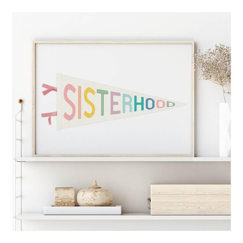 Minimalist sisterhood wall print styled on a shelf, empowering printable art for modern interiors.