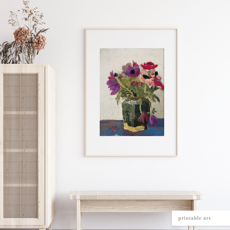 Antique flower painting displayed above a neutral cabinet, perfect for cottagecore or vintage interiors.