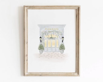 May include: A watercolor illustration of a Parisian storefront with a sign that reads "Fleuriste" above the door. The door is open and there are flowers and greenery hanging from the door frame. There are two potted plants on either side of the door.