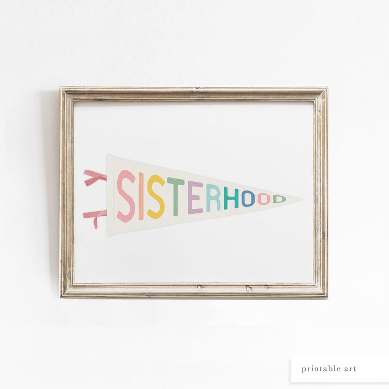Feminist pennant flag print in a rustic wood frame, inspirational sisterhood artwork for empowering spaces.