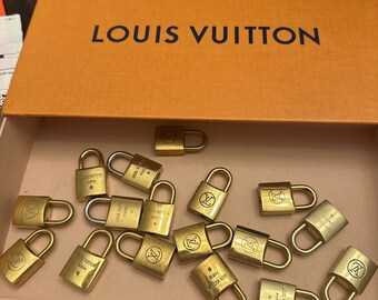 10 authentic Louis Vuitton locks. NO KEYS.