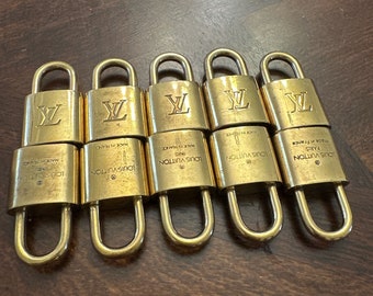 10 authentic Louis Vuitton locks. NO KEYS.