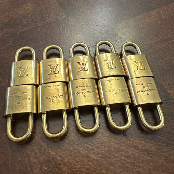 10 authentic Louis Vuitton locks. NO KEYS.