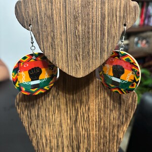 Orecchini Pugno di Potere Nero