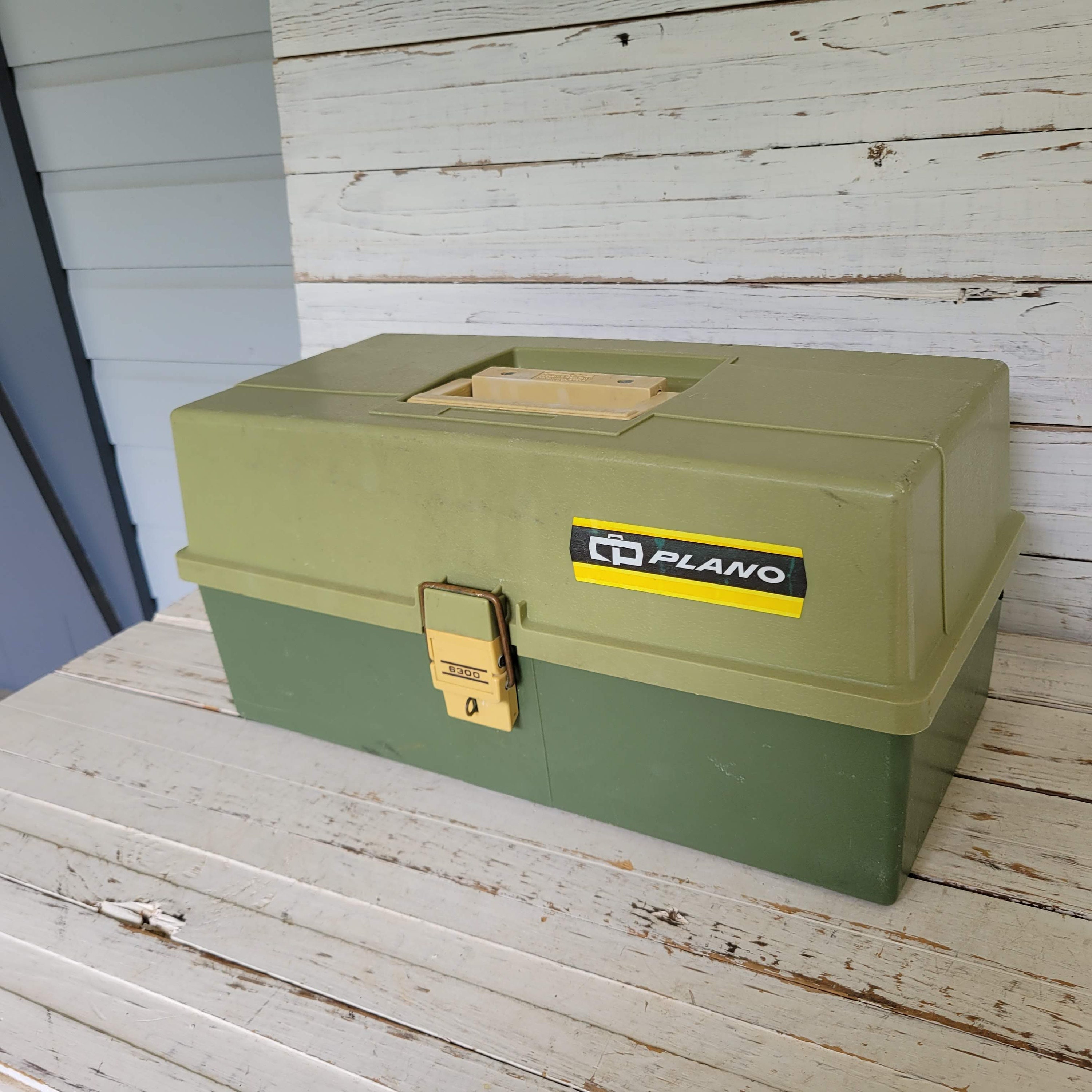 Lot - 2 drawer wooden tackle box loaded with lures and fishing supplies. Box  measures 22” x 11” x 6.5”.