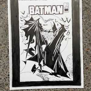 May include: Black and white Batman comic book cover art. The title "BATMAN" is at the top, with a bat symbol and issue details. The artwork features Batman with his cape spread, surrounded by bats, in a dramatic pose.