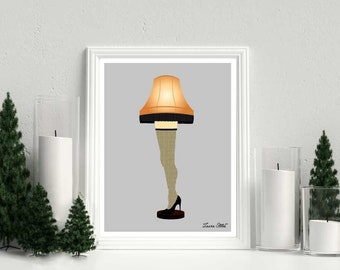May include: A print of a lamp with a leg and a high heel shoe. The lamp is a Christmas-themed lamp with a yellow shade and a black base. The print is on a gray background and has the text "Laura Steele" in the bottom right corner.