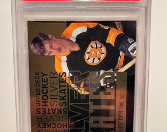 Patines plateados Upper Deck 2012 Bobby Orr PSA 8 de grado dorado con revestimiento