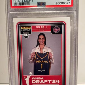 May include: A Caitlin Clark rookie card from the 2024 Panini Instant WNBA Draft Night series. The card features Clark holding an Indiana Fever jersey. The card is graded GEM MT 10.