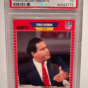 May include: A graded trading card of Chris Berman, a sportscaster for ESPN, from the 1989 Pro Set NFL Collectible series. The card is graded GEM MT 10 by PSA and has the number 5 on it. The card features a photo of Berman in a suit and tie, with the ESPN and NFL logos on the card.