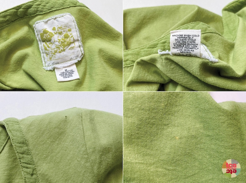 May include: Close-up of a light green shirt. The shirt has a tag with a floral design and another tag with washing instructions. The fabric appears to be a soft cotton material. The shirt is a medium size.