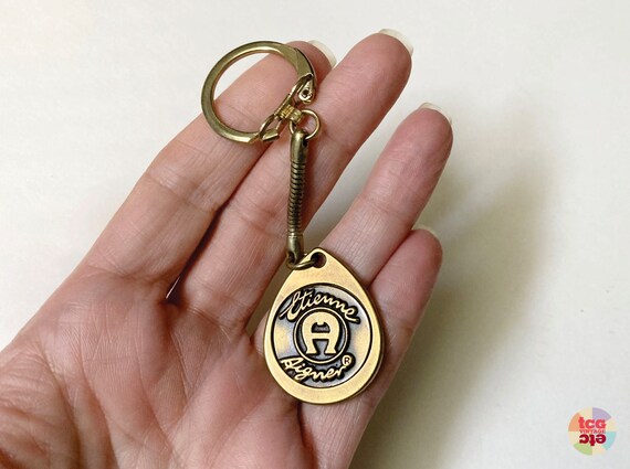 1970s Etienne Aigner Brass Keychain AE Logo Key Fob Teardrop Shape Disc Snake Chain Branded Plastic Bag EA Logo New Old Stock Vintage Etsy