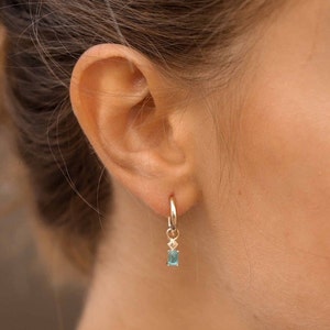 Hoop earrings with a 12mm rectangular blue baguette stone pendant in sterling silver and 24k gold-plated silver