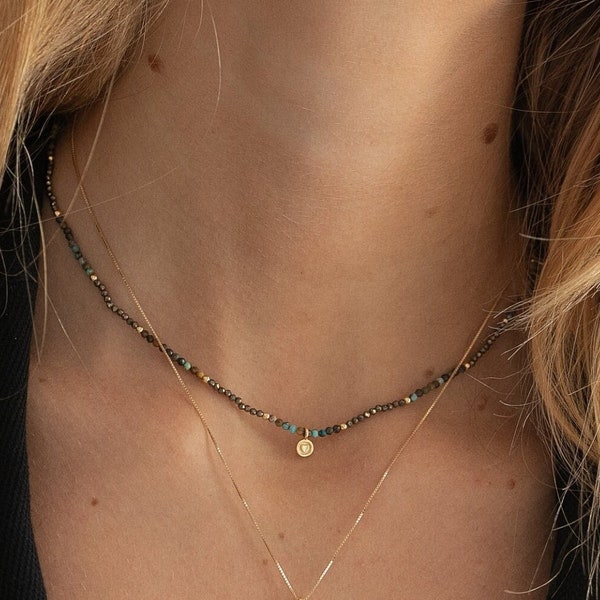 Choker of tiny beads made of natural stone pyrite and African turquoise with heart motif pendant in gold-plated silver