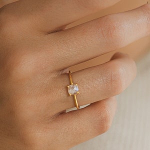 Ring with natural moonstone carved in a square and faceted shape in sterling silver and gold plated