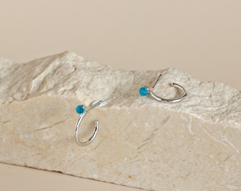 Semi-hoop earrings with light blue spherical zirconia made of sterling silver and gold-plated silver