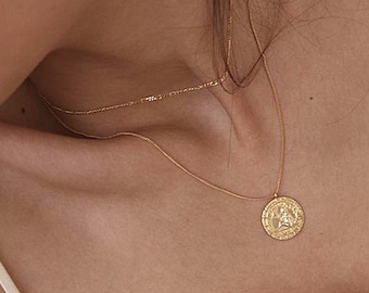 Double chain necklace with an ancient coin and a drawing of a woman stamped like an ancient coin in sterling silver and gold-plated silver