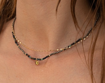 Natural African turquoise and pyrite stone bead necklace with a heart motif pendant in gold-plated silver