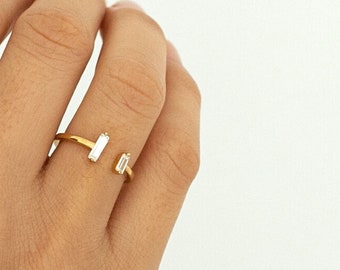 Thin open and adjustable ring with two vertical bars of faceted white cubic zirconia in sterling silver and gold-plated silver
