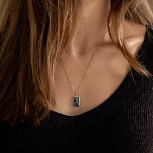 Rectangular pendant necklace with engraved hand in black turquoise stone and inlaid moon made in gold-plated sterling silver