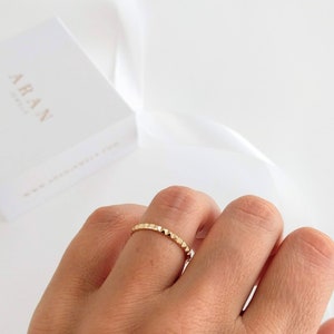 Ring with pyramid triangles with relief in silver and gold-plated silver