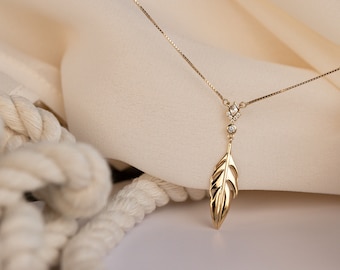 Beautiful exclusive design necklace with feather motif and zircons made of sterling silver and 24K gold plated