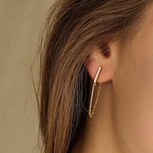 Bar earrings with cubic zirconia and hanging chain that connects to the back of the earring closure in silver