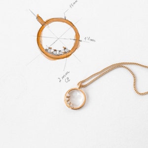 Necklace with gold circle motif pendant with 4 zircons in sterling silver and 24k gold plating, The Circle of Karma
