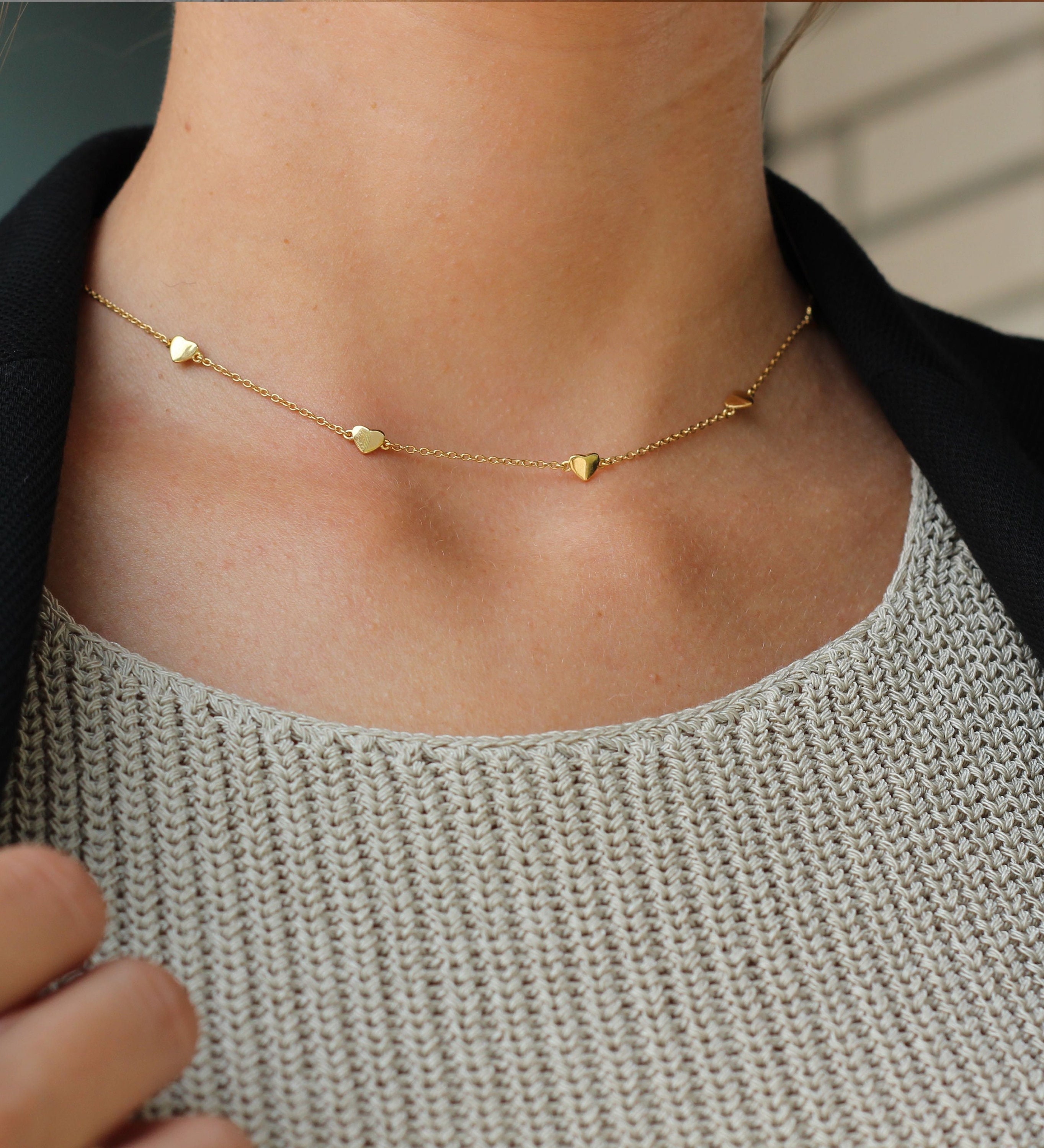 Necklace with cheap hearts all around