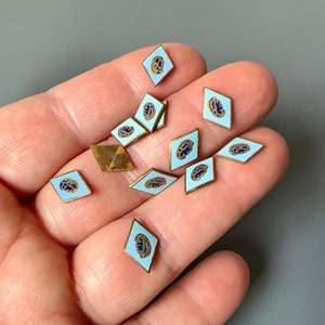 Beautiful tiny and detailed enameled metal flatbacks! Sold per 12 pieces. SKU 04113