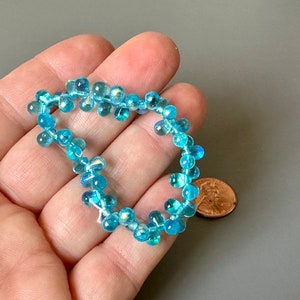 Stunning bright aqua AB Czech glass drops! Sold per lot of 50 beads. SKU 10111