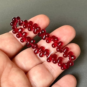 Ravishing transparent ruby red Czech glass drops! Sold per lot of 50 beads. SKU 09515