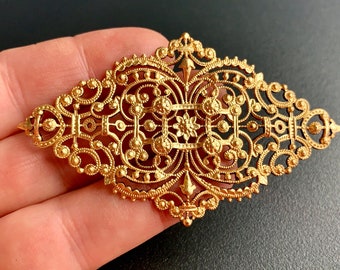 Truly beautiful vintage filigree. Very sturdy-- yet a delicate and intricate design.