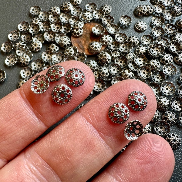 Lovely dark silver/rhodium finished textured bead caps! Sold per 50 pieces. SKU 16411