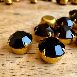 Vintage extra large jet black Swarovski round rhinestones set in brass! SS47 Sold per four pieces. SKU 09229