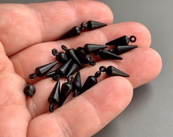 Very substantial for their small size. These are vintage powder black pendulum drops.
