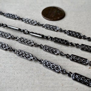 Gorgeous gunmetal plated filigree link chain! Sold per yard. SKU chain340