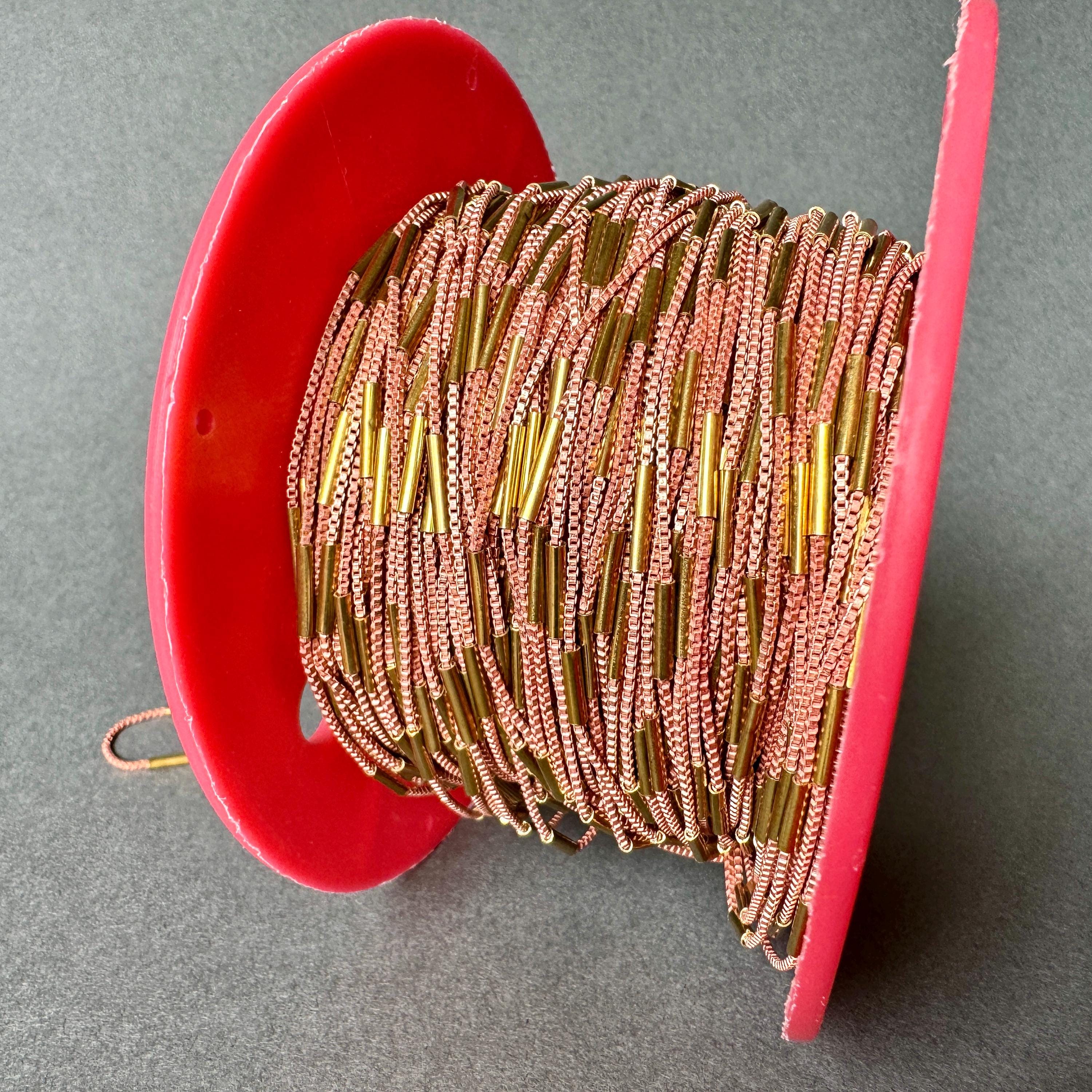 Specialty chain features a delicate yet strong copper box chain with flashy brass bugles along its' length! Sold per TWO yards. SKU chain625